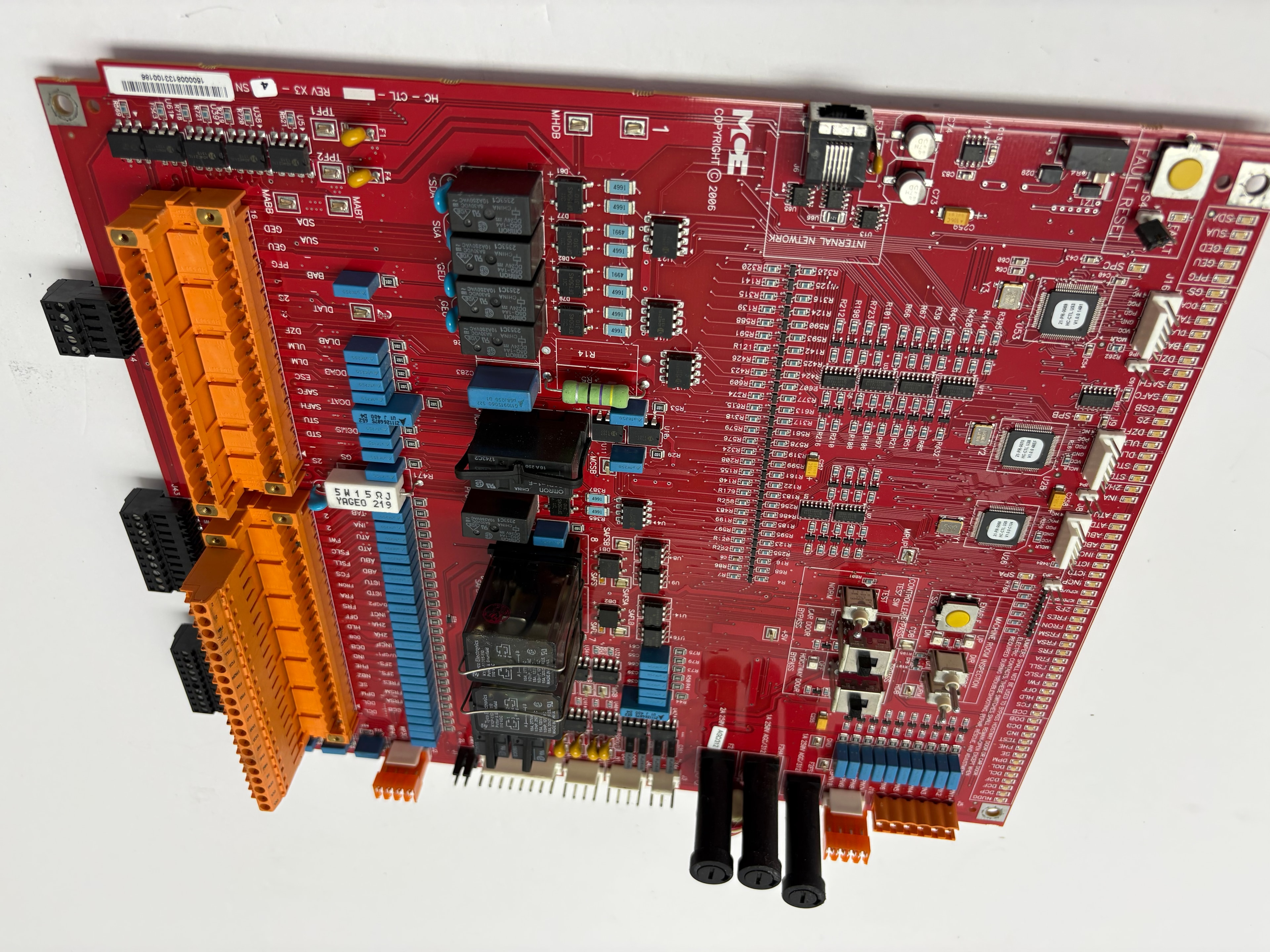 MCE Engineering HC-CTL WHDB main controller board — large red PCB with Omron relays, capacitors, extensive terminal blocks, REV X3–4