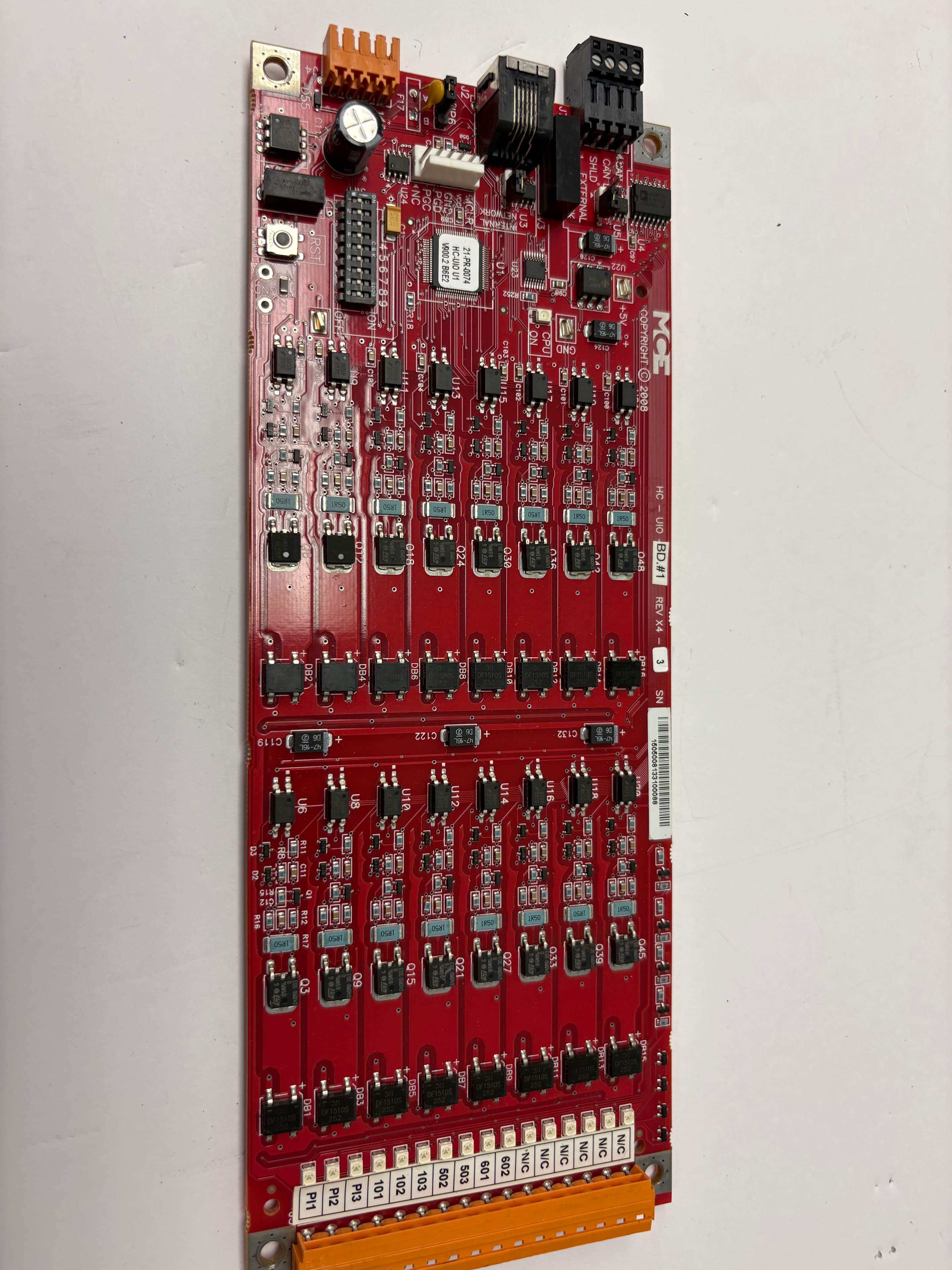 MCE Engineering HC-UIO BD.#1 universal I/O board — red PCB with transistor array, REV X4–3, Copyright 2008